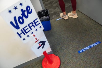 A sign during early voting at the Alexandria City Registrar Office in Alexandria, Virginia, on October 7. Reuters