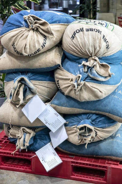 Jute sacks of coffee at the Raw Coffee Company storeroom. Antonie Robertson / The National