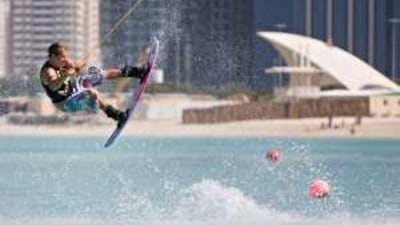 A wakeboarding professional gives a demonstration at the Abu Dhabi Corniche yesterday.