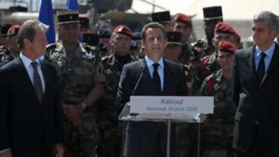 French President Nicolas Sarkozy (Centre) is flanked by the French Foreign Minister Bernard Kouchner (Left) and French Defence Minister Hervé Morin (Right ) as he addresses French soldiers from the 8th regiment of paratroopers at Camp Warehouse in Kabul today