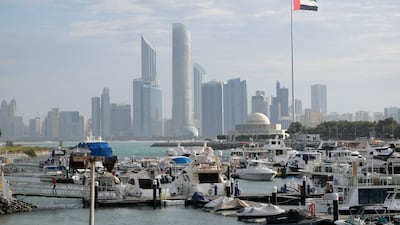 The Abu Dhabi skyline. The emirate's industrial strategy, announced in 2022, aims to double the size of industrial sector to Dh172 billion. Khushnum Bhandari / The National
