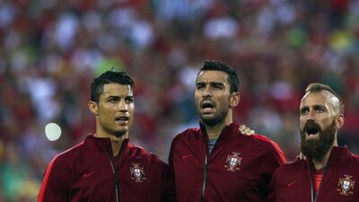 Portugal players Cristiano Ronaldo, left, Rui Patricio, centre, and Raul Meireles, right, during the national anthems before the start of Tuesday's international friendly against Ireland. Jose Sena Goulao / EPA / June 10, 2014