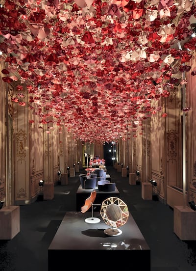 Origami Flowers hang overhead at Palazzo Bocconi. Courtesy Louis Vuitton