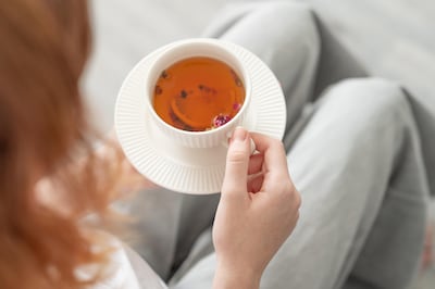 Replace coffee with black or herbal teas, which have significantly less caffeine. Getty