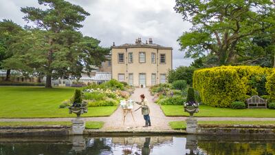 Rebecca Styles, artist in residence at Thorp Perrow, paints a picture at the arboretum in North Yorkshire, as part of a twelve-month project documenting the site's transformation from spring through to winter. PA