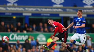 Wayne Rooney of Manchester United scores his team’s third goal against Everton on Saturday in a Premier League victory. Clive Brunskill / Getty Images