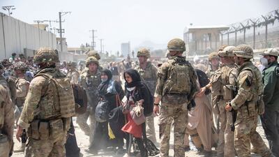 UK and US military operative work on the evacuation effort in Kabul after the Taliban took control of the city. Photo: Ministry of Defence