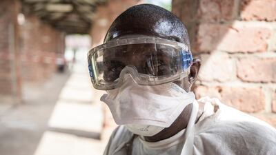 A health worker outside the isolation ward at Bikoro Hospital, where suspected Ebola patients are diagnosed and treated, in Bikoro, DRC, during a previous outbreak in May. Mark Naftalin / EPA