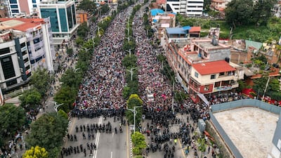 Demonstrators outside Nepal's parliament during the protest. Hundreds of people were injured when demonstrators tried to storm a restricted area and police responded with rubber bullets, tear gas, water cannon and batons. AFP