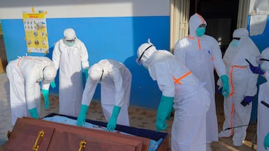 Staff carry the body of an Ebola victim at a hospital in Ituri province, in the Democratic Republic of the Congo. EPA