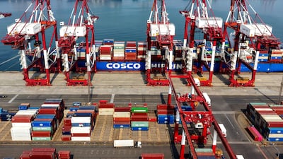 A cargo ship operated by Cosco Shipping at Qingdao Port in eastern Shandong province. According to an online shipping tracker, two of its vessels have crossed the Strait of Hormuz unmolested. AFP