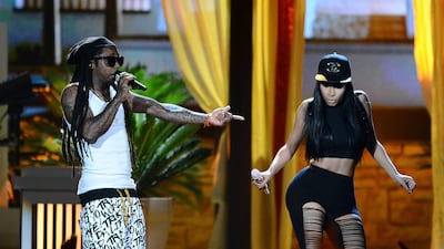 Nicki Minaj, right, and Lil Wayne perform onstage during the 2013 Billboard Music Awards. Minaj won the first award in the live telecast for top rap artist, beating out Drake, Flo Rida, Pitbull and Psy. Ethan Miller / Getty Images / AFP