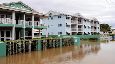 Apartment blocks sit in floodwaters. AFP