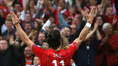 Gareth Bale celebrates scoring against Belgium in Friday night's 1-0 Euro 2016 qualifying win over the Belgians in Cardiff. Geoff Caddick / EPA