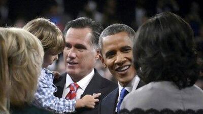 President Barack Obama and Republican presidential nominee Mitt Romney greet family members following the final US presidential debate in Boca Raton, Florida.