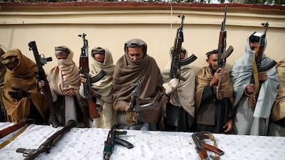 Former Taliban and ISIS militants surrender their weapons during a reconciliation ceremony in Jalalabad, Afghanistan. EPA