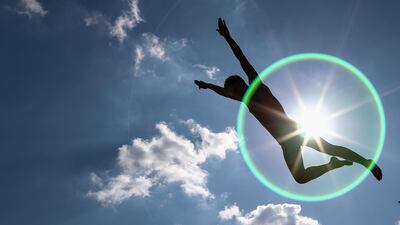 A Syrian refugee boy jumps into water over the Karakoy ferry station on the first day of Eid al-Adha celebrations in Istanbul, Turkey. EPA