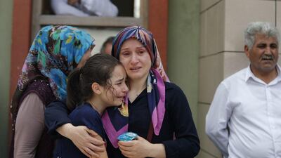 Family members of victims cry outside the Forensic Medical Centre in Istanbul on June 29, 2016, a day after suicide attackers killed dozens and wounded more than 140 at Istanbul's busy Ataturk Airport. Emrah Gurel / AP Photo