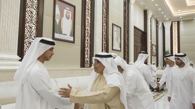 Sheikh Mansour bin Zayed, Deputy Prime Minister and Minister of Presidential Affairs, left, with members of Al Jazira Football Club during an iftar reception at Al Bateen Palace. Mohamed Al Hammadi / Crown Prince Court - Abu Dhabi