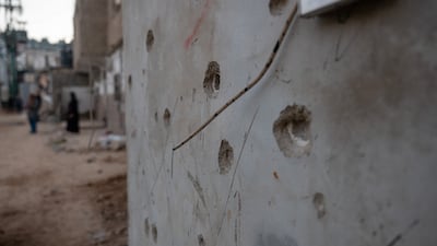 Bullet holes in a wall in Jenin, West Bank. Getty Images