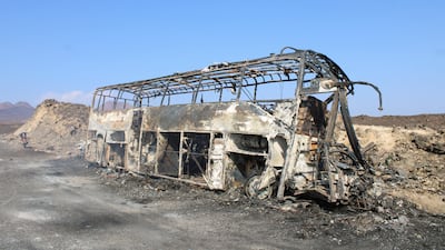 The wreckage of the bus after it burst into flames in Abyan, Yemen. Reuters