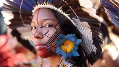 A woman from the Pataxo indigenous people attends a march in defence of women's rights, indigenous people and the environment, in Brasilia, Brazil. Reuters