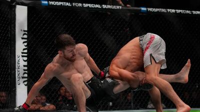 Umar Nurmagomedov attempts to take Cory Sandhagen to the ground at UFC Fight Night in Abu Dhabi.