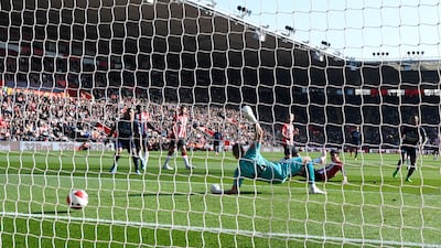 Southampton goalkeeper Fraser Forster is beaten by Raheem Sterling's finish for the opening goal. AFP