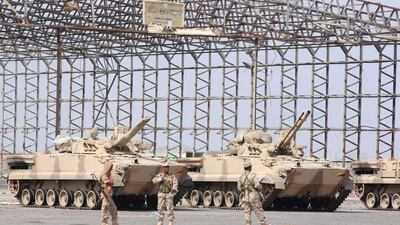 Yemeni security forces loyal to president Abdrabu Mansur Hadi guard Aden's international airport after being handed responsibility for the facility's security by resistance fighters on January 7, 2016. Saleh Al Obeidi/AFP Photo