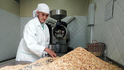 An Amazigh woman sifts through argan kernels at the Women's Agricultural Cooperative Taitmatine, in Tiout, Morocco. Reuters