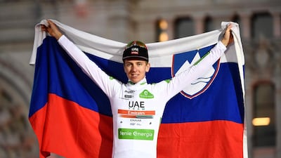 Team UAE Emirates rider Slovenia's Tadej Pogacar celebrates his third place. AFP