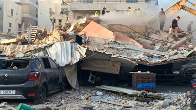 Rescuers search for survivors at the site of an Israeli air strike in the southern Lebanese city of Tyre on Monday. AFP