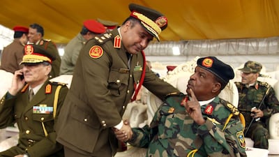 Self-proclaimed Libyan National Army's (LNA) Chief of special forces Major General Wanis Boukhmada (1st-R) attends a graduation ceremony in Benghazi. AFP
