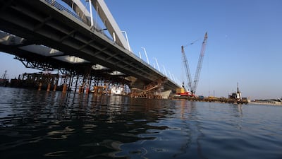 Final touches are carried out on Sheikh Zayed Bridge a month from its inauguration. Rich-Joseph Facun/The National