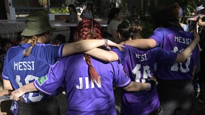 BTS fans wear Argentina's football team shirts, with one specifically for Jin.