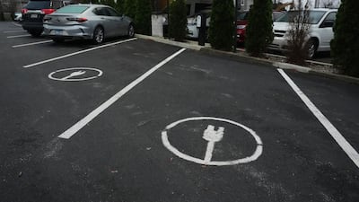 Electric vehicles charging in Evansville, Indiana. The US's lates way forward on energy presents competitors with opportunities. AP Photo