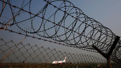An aircraft belonging to Malaysian airline Malindo Air is stuck in mud on April 20, 2018 after skidding off the runway at Tribhuvan International Airport in Kathmandu, Nepal. Navesh Chitrakar / Reuters