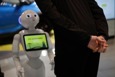 A guests asks robot Robby Pepper for information at the hotel in Peschiera del Garda, northern Italy. Luca Bruno/AP)