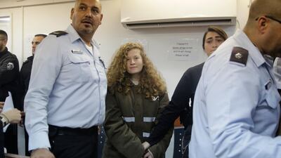 Ahed Tamimi is brought to a courtroom inside the Ofer military prison near Jerusalem on January 15, 2018. AP / Sebastian Scheiner)