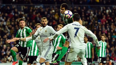 Real Madrid’s Portuguese forward Cristiano Ronaldo, right, vies with Betis’ Serbian midfielder Aissa Mandi. Gerard Julien / AFP