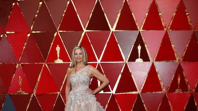 NEUTRAL TONES: Of course no Academy Awards would be complete without huge, dreamy gowns, and this year Mira Sorvino arrived looking like a princess in an elaborate confection of nude tulle overlayed with applique flowers. One shouldered, full skirted, and with a long train, she offset the drama of it all with barely there make up, and a simple side parting in her loose hair. EPA