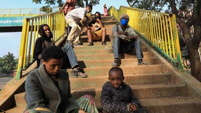 Refugees from different East African countries sit on the staircases of a footbridge where they sleep, ahead of World Refugee Day in Nairobi, Kenya. World Refugee Day is marked annually on 20 June to raise awareness of the situation of refugees around the world. According to the UNHCR, more and more refugees today live in urban settings outside refugee camps. Some crises have lasted so long that the tent camps became built-up urban areas. EPA