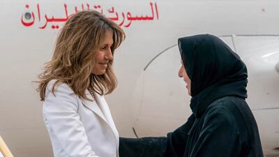 Maitha Al Shamsi, Minister of State, greets Syria's first lady Asma Al Assad. AFP