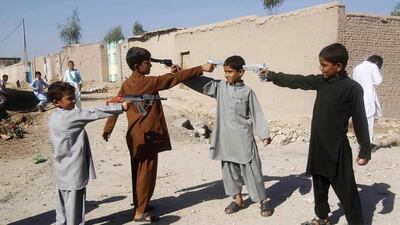 Afghan boys play with toy guns on the first day of Eid Al Adha in Jalalabad. Parwiz / Reuters