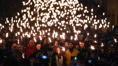 Members of the public take part during the torchlight procession on Edinburgh's Royal Mile for the start of the Hogmanay celebrations. Getty
