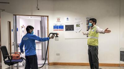 Staff are hosed down with a mild disinfectant before entering public areas