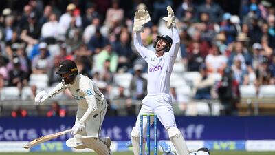 Replacement England wicketkeeper Sam Billings reacts as an edge from Tom Blundell goes past Joe Root at slip. Getty