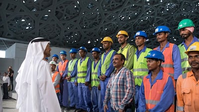 Sheikh Mohammed bin Zayed speaks with construction workers. Ryan Carter / Crown Prince Court - Abu Dhabi
