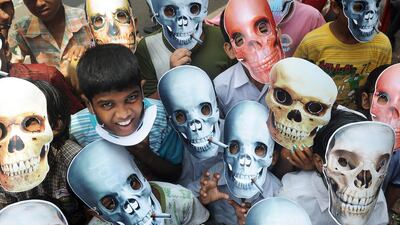 Young schoolchildren wear anti-smoking masks during a ‘No Tobacco’ rally in Kolkata in 2012. World No Tobacco Day is observed around the world every year on May 31 and is one of the important World Health Awareness days organized by the World Health Organisation (WHO). Dibyangshu Sarkar / AFP photo