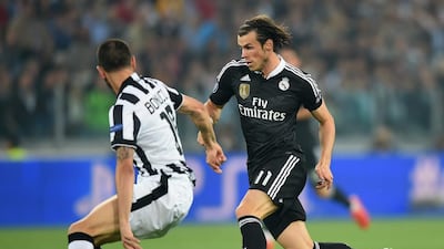 Gareth Bale of Real Madrid dribbles past Leonardo Bonucci of Juventus during their Champions League contest on Tuesday. Michael Regan / Getty Images